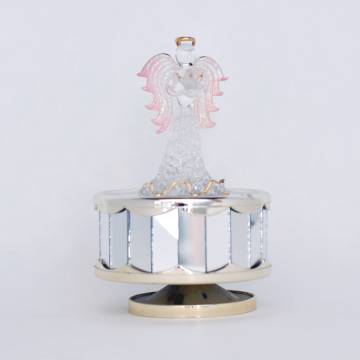 Music box with glass angel.