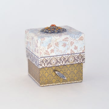 Music box with ceramic birds.